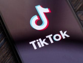 An image of the TikTok logo on a phone screen